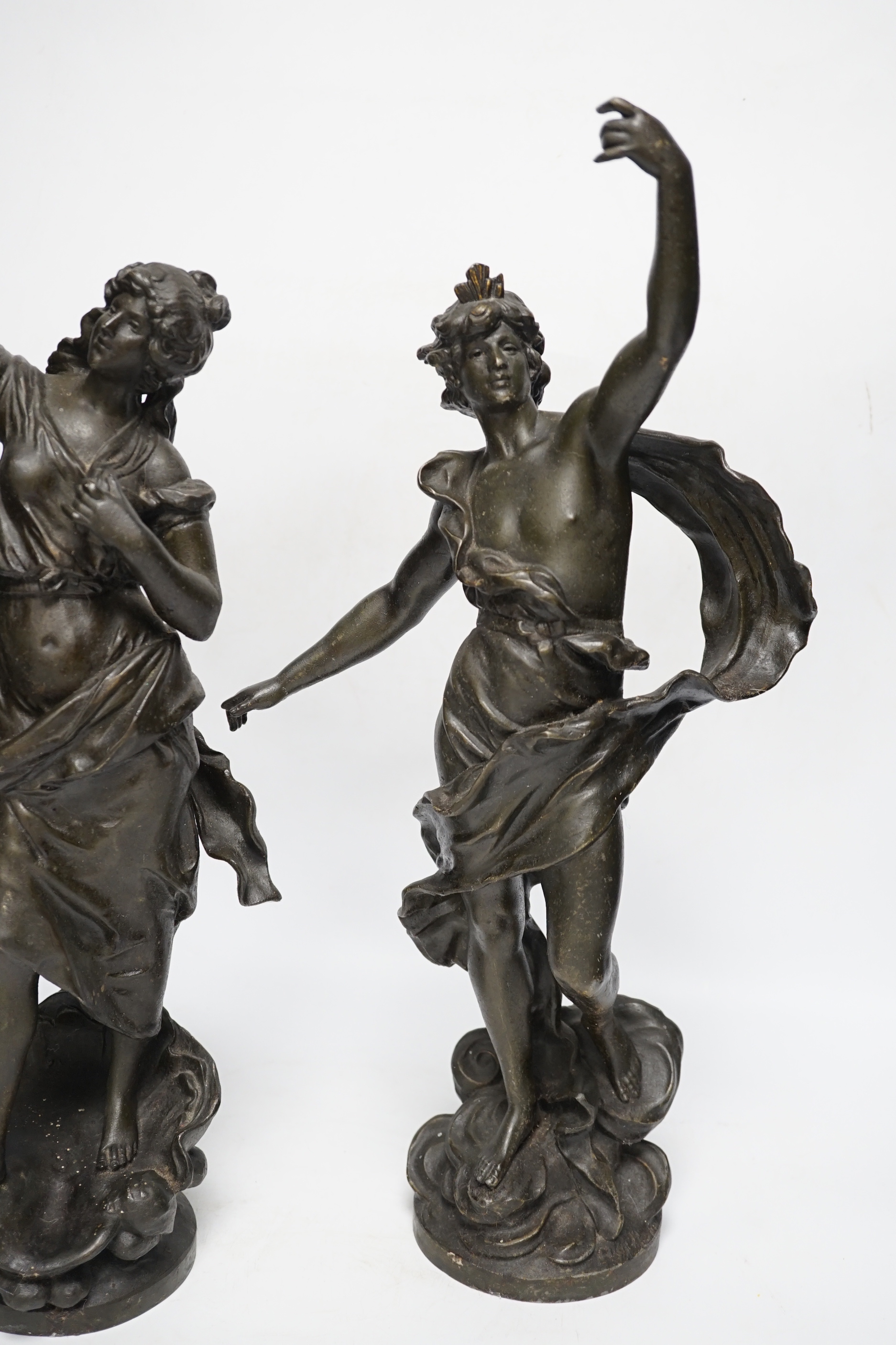 A pair of patinated spelter figures, 47cm